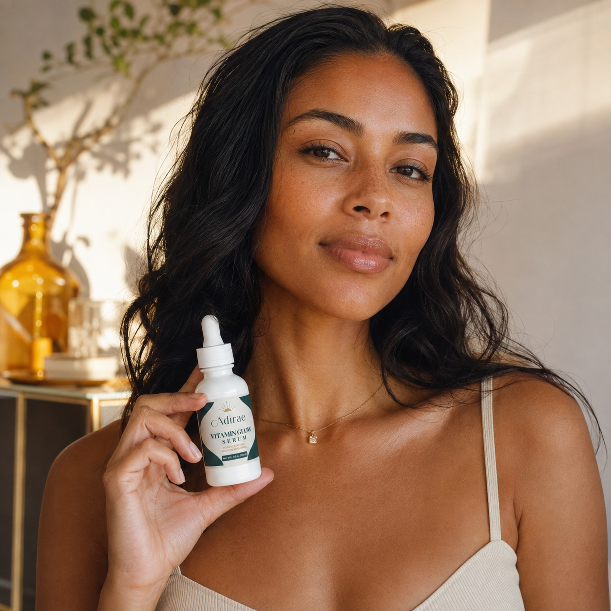 Vitamin Glow Serum held by model